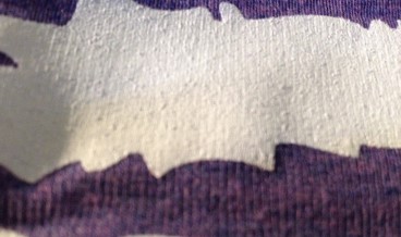 This print is a triblend garment printed with a white, bleed-resistant ink and part of the printing on tri-blend apparel how to by Bulk Apparel wholesaler.
